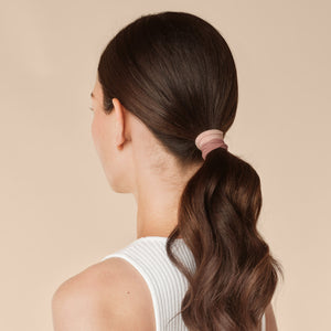 Rosewood Seamless Hair Elastics 12pc Set - model from behind with low ponytail secured with rosewood seamless hair ties