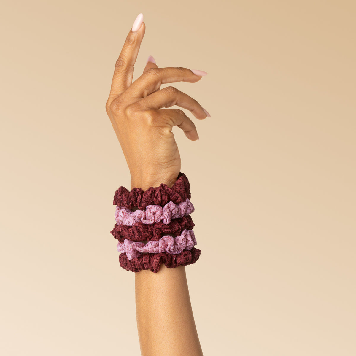 KITSCH Ruched Lace Scrunchies 5pc Set - Cherry Lacquer & Dusty Pink - scrunchie held in hand