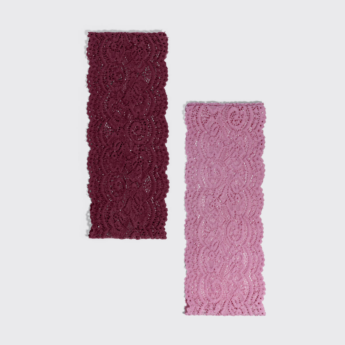 KITSCH Cherry Lacquer & Dusty Pink Wide Lace Headbands 2pc Set — the cherry lacquer and dusty pink lace headbands laid side by side — delicate texture adds a romantic yet modern touch to any style — choosing between the two shades