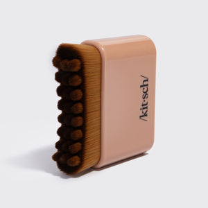 Close-up of the terracotta Kitsch Lymphatic Contour Face Brush showing its soft hypoallergenic bristles
