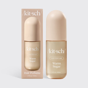 Kitsch Warm Sugar Hair & Body Perfume Mist bottle on a soft pink background