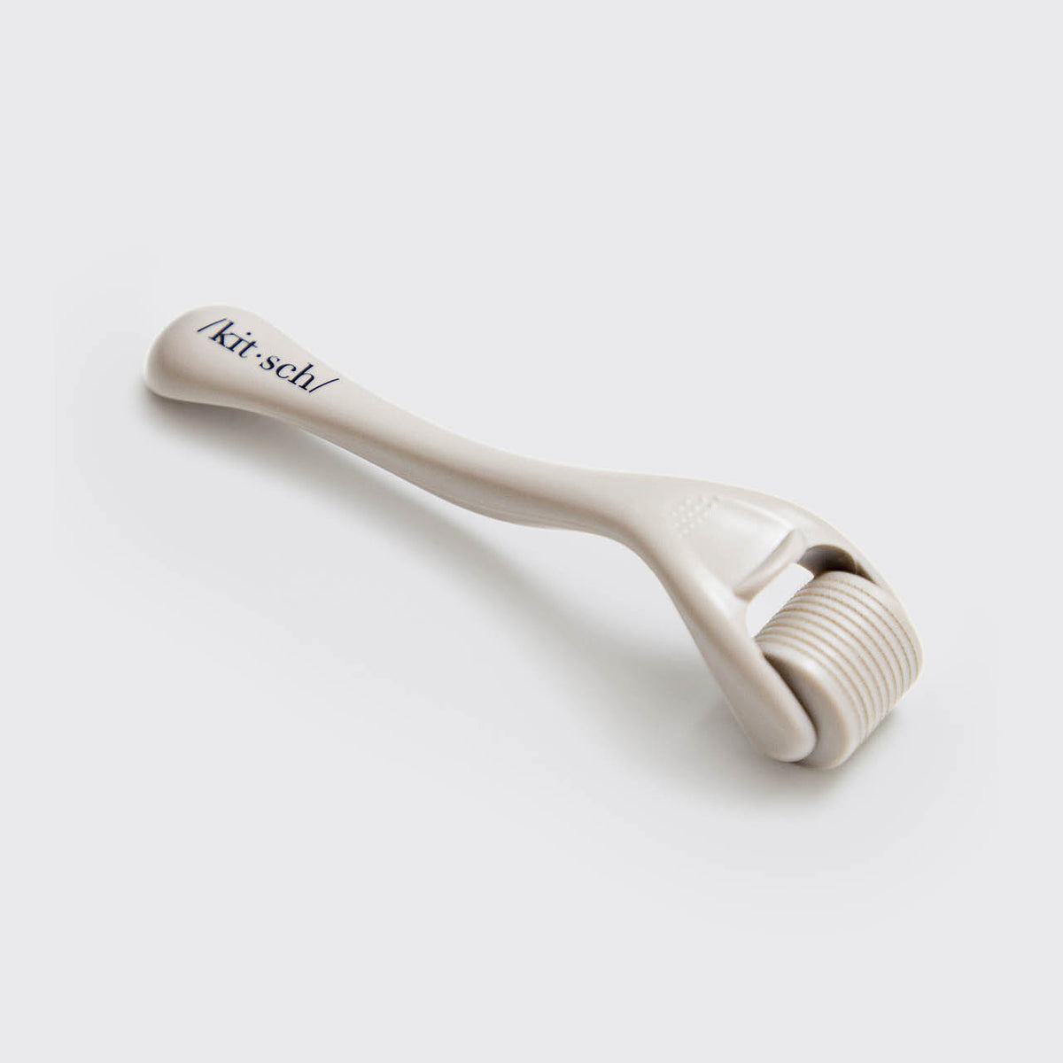 KITSCH Warm Gray Micro Derma Roller — detail shot of the micro-needle roller head — 0.25mm stainless steel micro-needle technology — engineered for controlled, even coverage
