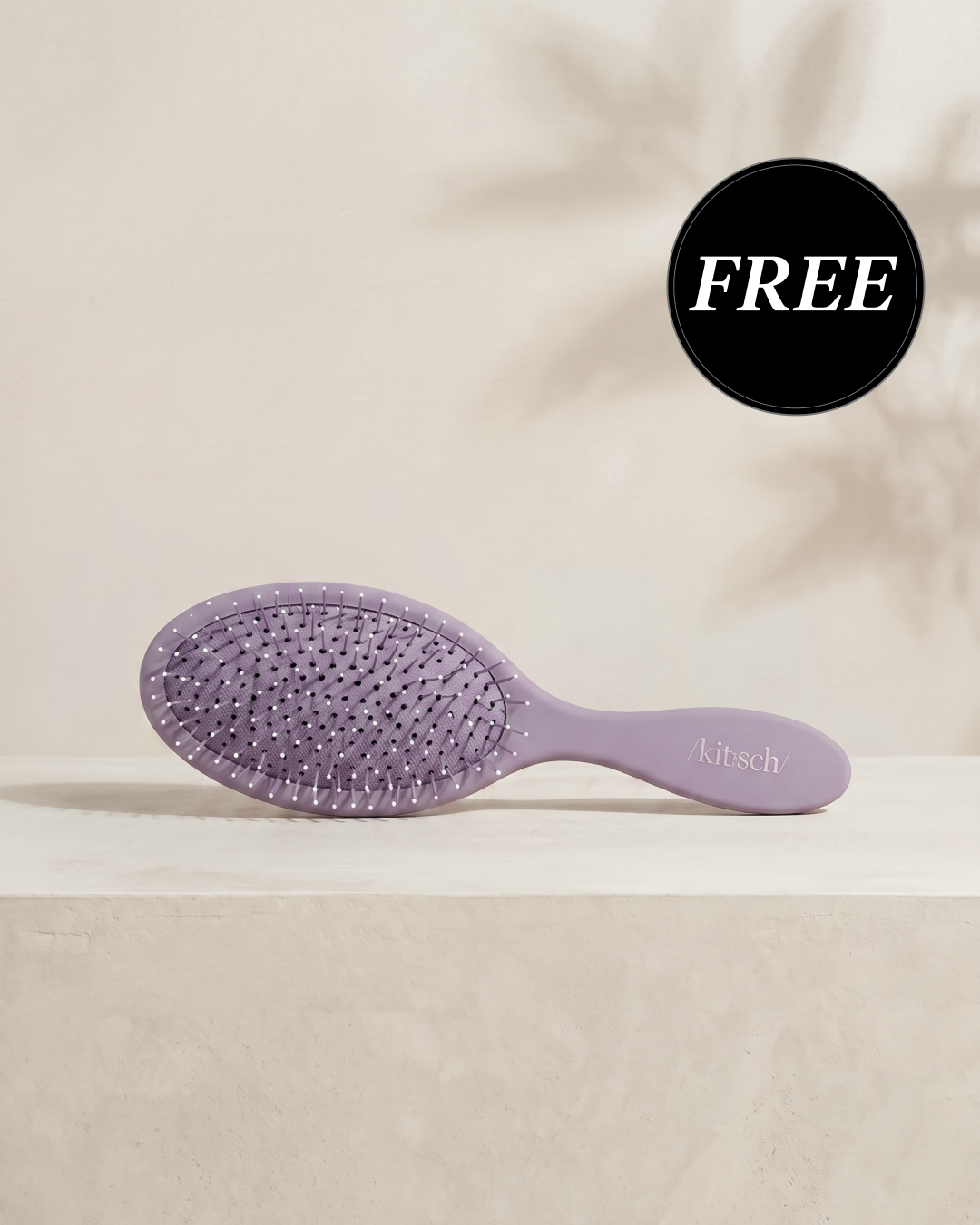 Kitsch Soft Violet Wet/Dry Brush shown with its retail packaging, flexible bristles designed to glide through knots and tangles without pulling hair
