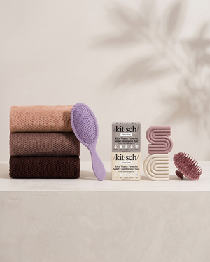 Kitsch Spring Welcome Kit Rice Water shown as a full bundle with the Strengthening Rice Water Shampoo and Conditioner Bars, Soft Violet Wet/Dry Brush, Terracotta Scalp Exfoliator and Rosewood African Net Sponge on a soft neutral background